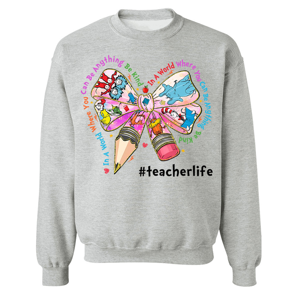 In A World Where You Can Be Anything Be Kind Custom Shirt Gift For Teacher Read Across America Day Coquette Reading Shirt H2511 Do99