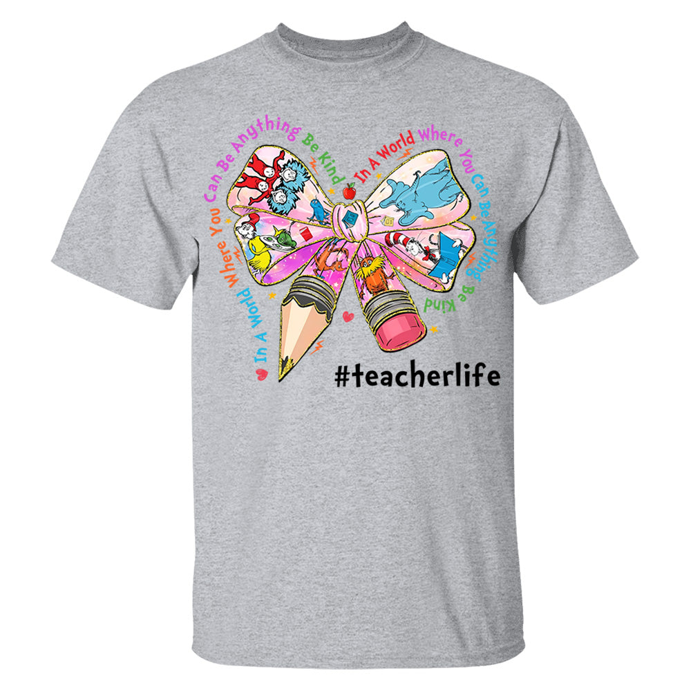 In A World Where You Can Be Anything Be Kind Custom Shirt Gift For Teacher Read Across America Day Coquette Reading Shirt H2511 Do99
